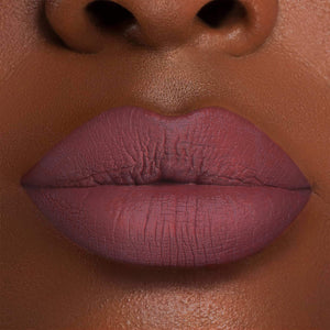 Conqueror is a unique organic matte lipstick that provides a vibrant violet hue with a twinkle of sparkles. This long-lasting formula creates an eye-catching stateme